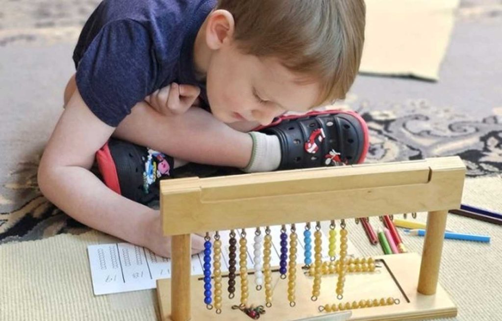 Child With Montessori Bead Chains